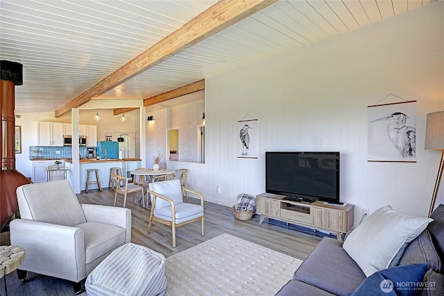 1892 Cascade View Dr, Camano Island, WA 98282 - living area featuring baseboards, beamed ceiling, and wood finished floors