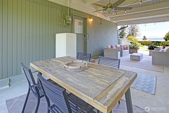 1892 Cascade View Dr, Camano Island, WA 98282 - view of patio / terrace with an outdoor living space, a ceiling fan, and outdoor dining space