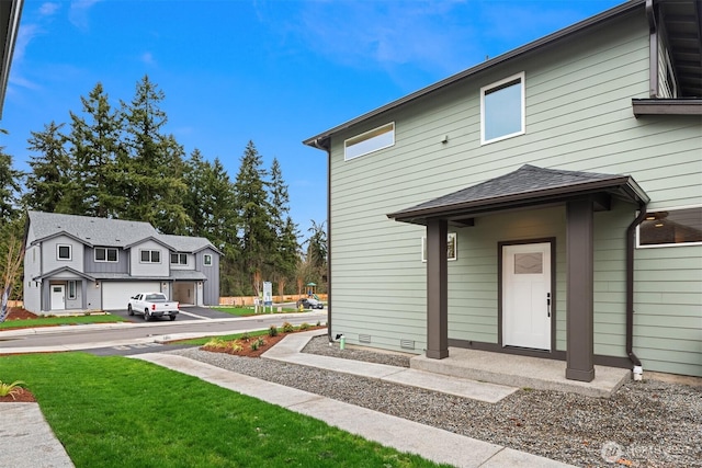 1240 SW 124th St Unit 10B, Burien, WA 98146 - rear view of house featuring a yard and roof with shingles