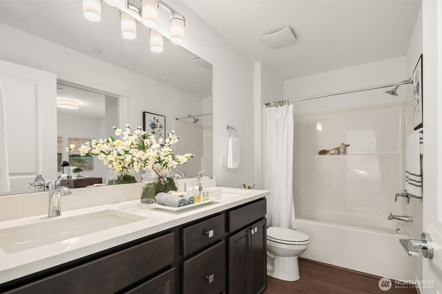 1240 SW 124th St Unit 10B, Burien, WA 98146 - full bathroom with toilet, shower / tub combo, wood finished floors, and a sink