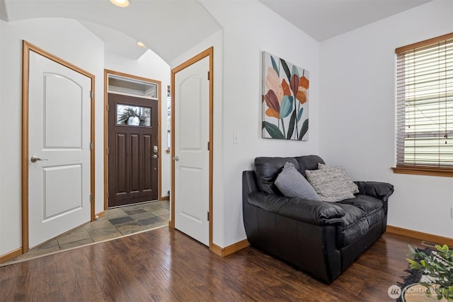 foyer entrance with baseboards, visible vents, recessed lighting, and dark wood-type flooring