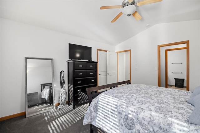 bedroom featuring ceiling fan, carpet floors, baseboards, vaulted ceiling, and a closet