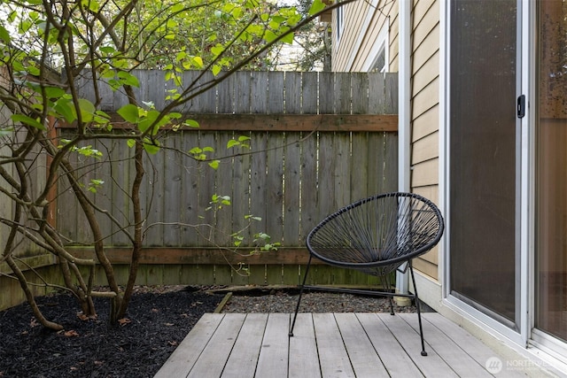 wooden deck featuring fence