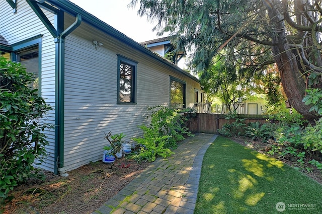 view of property exterior featuring fence
