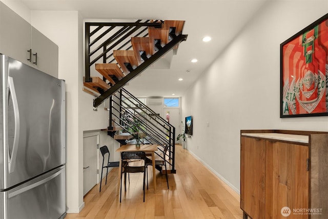 interior space featuring wood-type flooring, recessed lighting, and baseboards