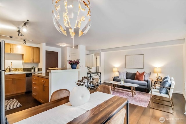 3661 Phinney Ave N Unit 208, Seattle, WA 98103 - dining room featuring an inviting chandelier and dark wood-style floors