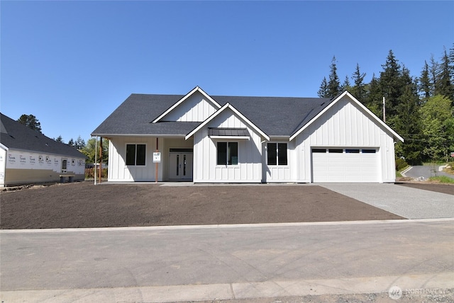 modern inspired farmhouse featuring a garage, board and batten siding, roof with shingles, and driveway