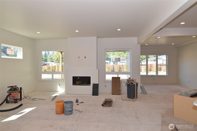 unfurnished living room with a fireplace and recessed lighting