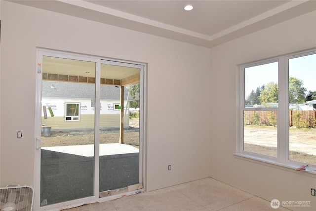 spare room with plenty of natural light and light tile patterned floors
