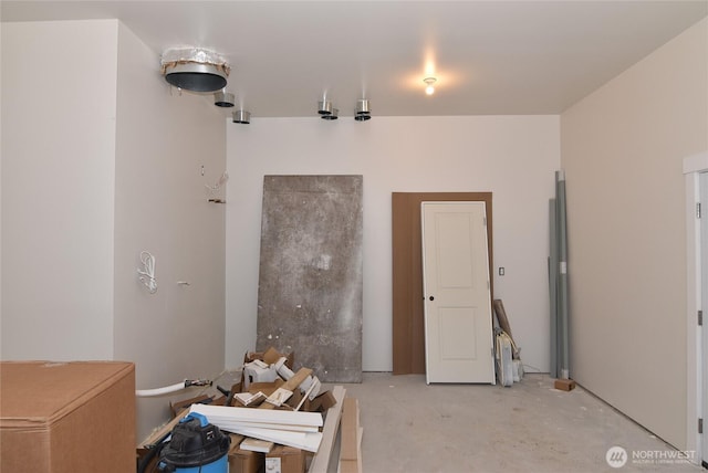 misc room with concrete floors