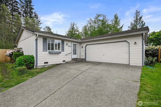 ranch-style house with fence, an attached garage, concrete driveway, and crawl space