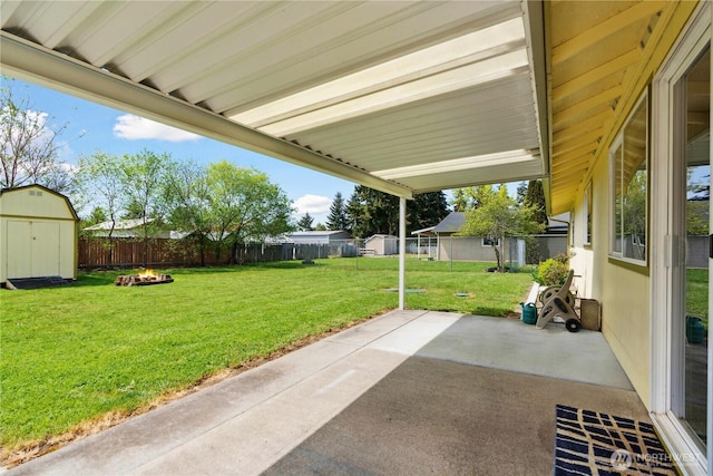 16649 100th Way SE, Yelm, WA 98597 - view of patio with a storage unit, an outdoor structure, and an outdoor fire pit