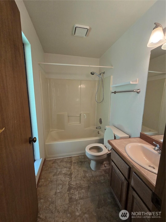 6307 168th St SW, Lynnwood, WA 98037 - bathroom featuring toilet, bathing tub / shower combination, vanity, and visible vents