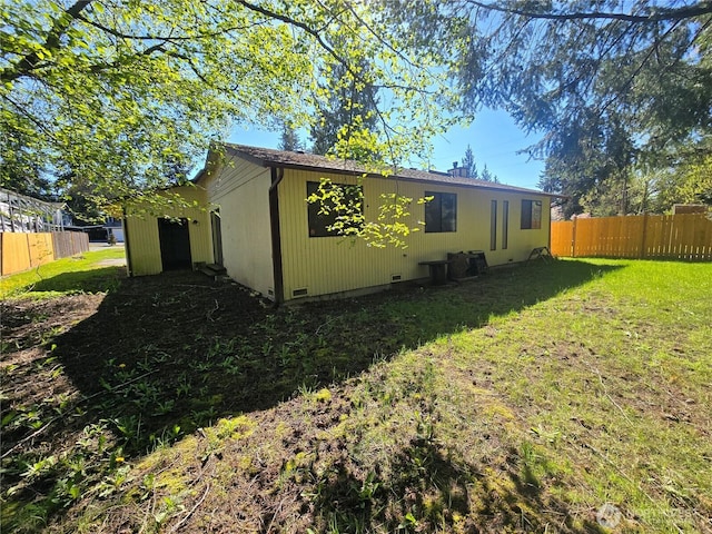 6307 168th St SW, Lynnwood, WA 98037 - back of house with a yard, fence, and crawl space
