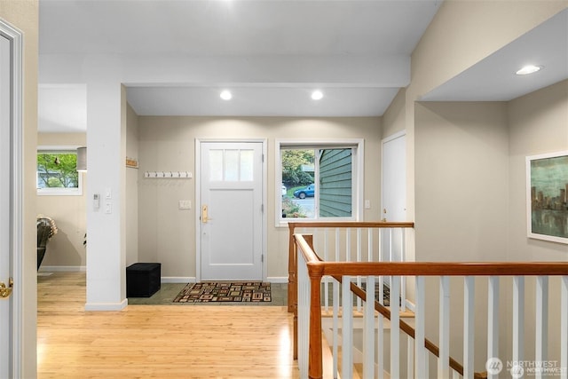 entrance foyer featuring recessed lighting, baseboards, and wood finished floors