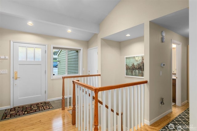 entryway with recessed lighting, baseboards, and wood finished floors