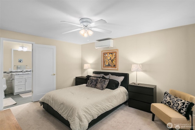 bedroom with connected bathroom, ceiling fan, a wall mounted AC, and a sink
