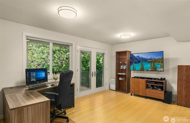 office space featuring french doors and light wood-style floors