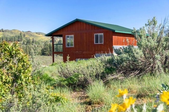 view of home's exterior with a mountain view
