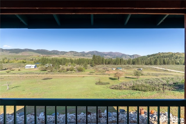 mountain view featuring a rural view