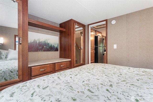 990 S Lake Whatcom Blvd Unit 9, Sedro Woolley, WA 98284 - bedroom featuring freestanding refrigerator