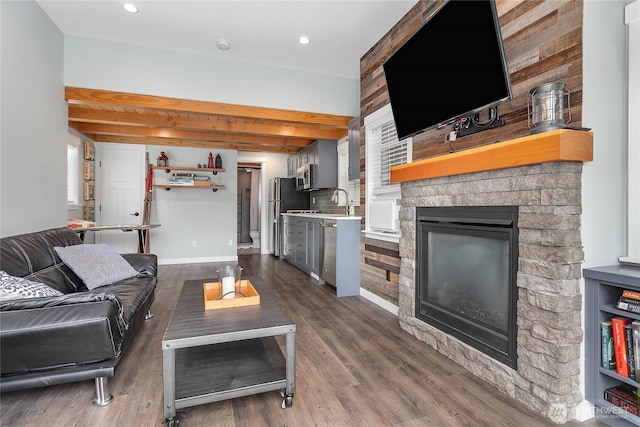 990 S Lake Whatcom Blvd Unit 65, Sedro Woolley, WA 98284 - living area with a fireplace, baseboards, beamed ceiling, recessed lighting, and dark wood-type flooring