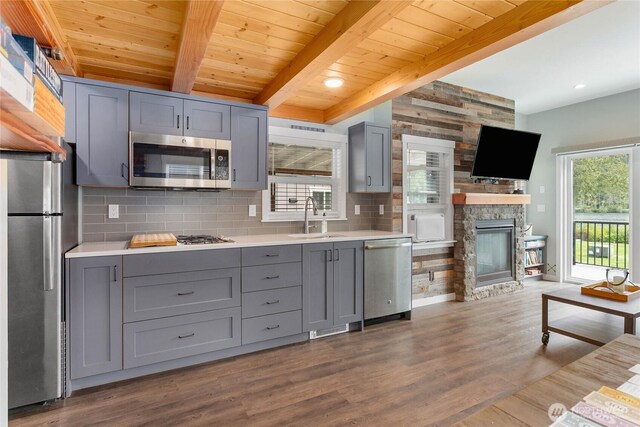 990 S Lake Whatcom Blvd Unit 65, Sedro Woolley, WA 98284 - kitchen with stainless steel appliances, a sink, gray cabinets, and tasteful backsplash