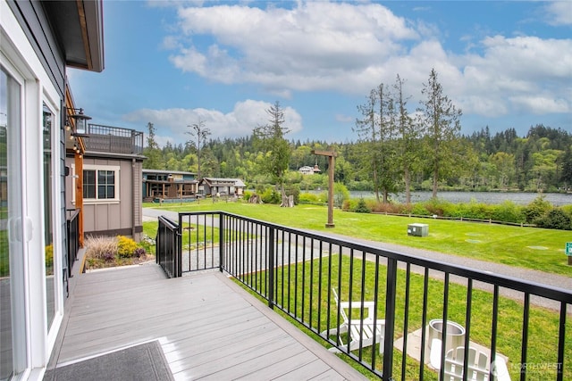 990 S Lake Whatcom Blvd Unit 65, Sedro Woolley, WA 98284 - wooden terrace featuring a lawn and a water view