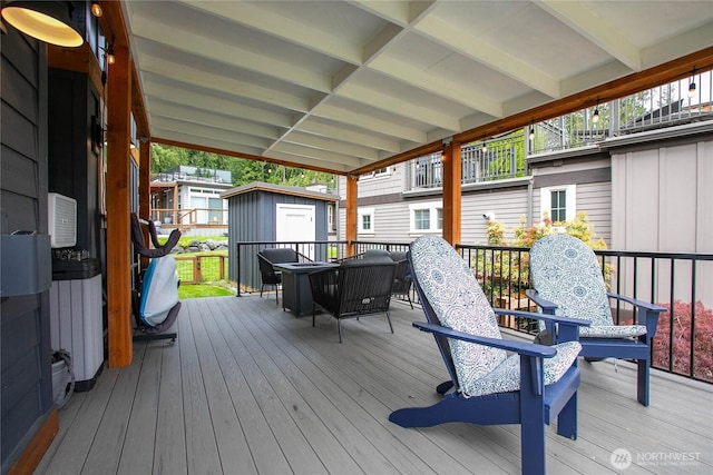 990 S Lake Whatcom Blvd Unit 65, Sedro Woolley, WA 98284 - wooden terrace with an outdoor structure and a shed