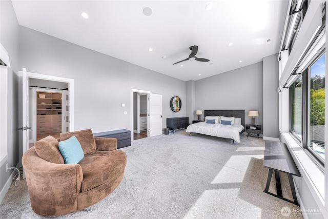 bedroom featuring carpet floors, recessed lighting, baseboards, and a spacious closet