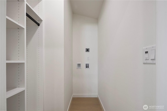 spacious closet featuring wood finished floors