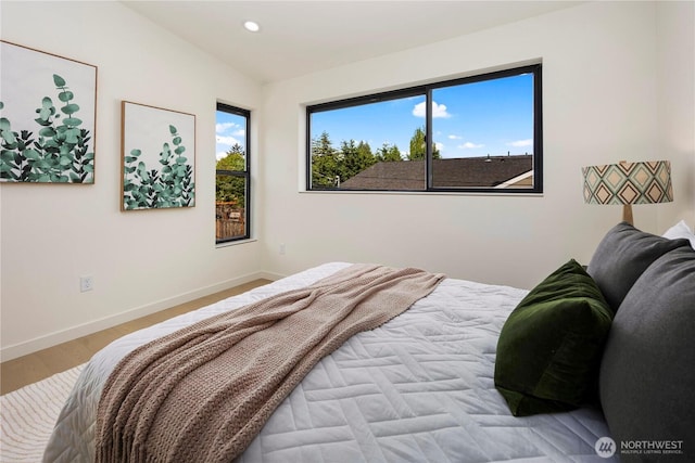 bedroom with recessed lighting, baseboards, and wood finished floors