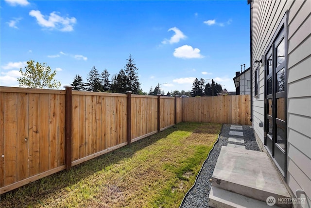 view of yard featuring a fenced backyard