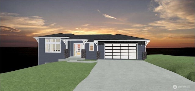 prairie-style home featuring a garage, driveway, and a front lawn