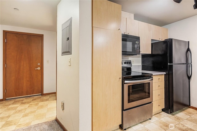 412 11th Ave, Seattle, WA 98122 - kitchen with black appliances, electric panel, light brown cabinetry, and baseboards