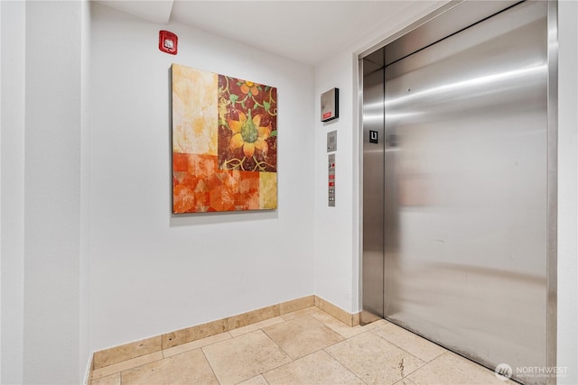 412 11th Ave, Seattle, WA 98122 - hallway featuring elevator and baseboards