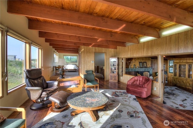 420W Lough Ln, Westport, WA 98595 - living area featuring wood ceiling, wood finished floors, beam ceiling, baseboards, and wooden walls