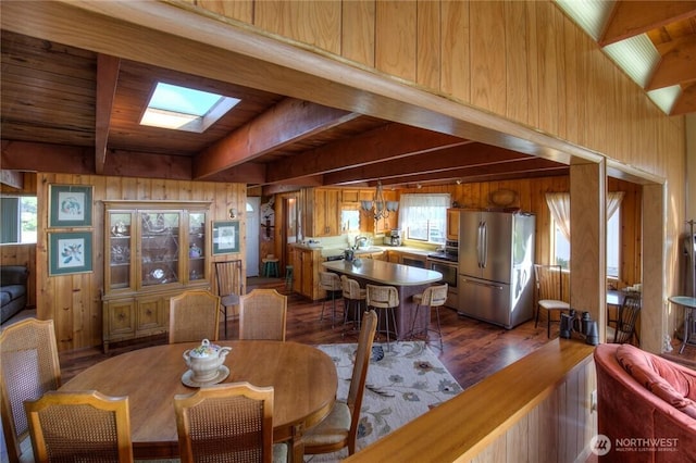 420W Lough Ln, Westport, WA 98595 - dining space featuring a wealth of natural light, wood ceiling, wooden walls, dark wood-type flooring, and beam ceiling