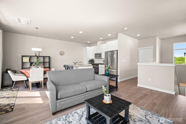 4818 Springside St, Bellingham, WA 98226 - living room featuring light wood-style flooring and recessed lighting