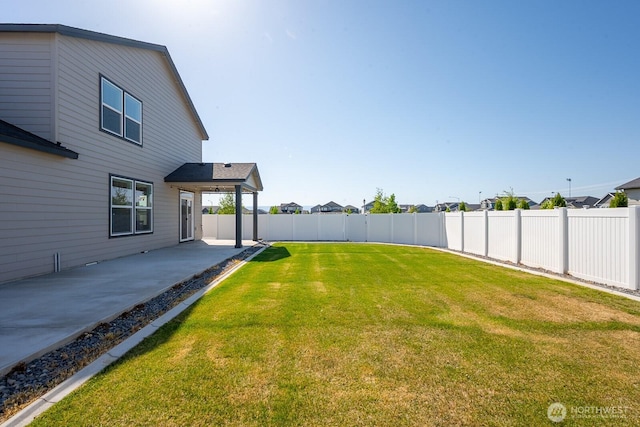 view of yard featuring a fenced backyard and a patio area