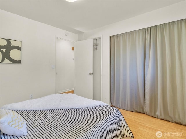 bedroom with wood finished floors