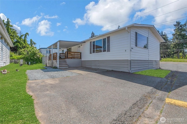 22018 28th Pl S Unit 5, Des Moines, WA 98198 - manufactured / mobile home with stairs, covered porch, and a front yard