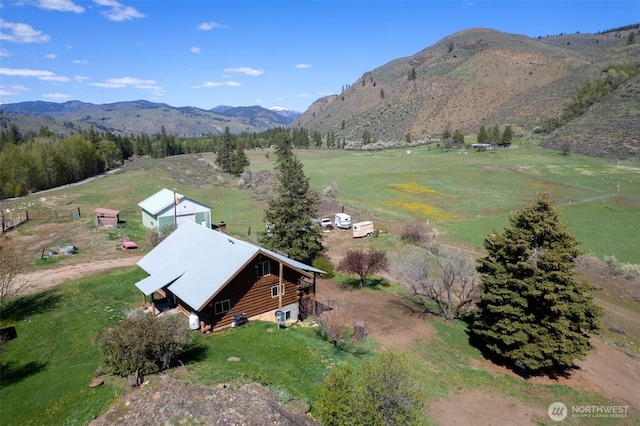 drone / aerial view with a mountain view and a rural view