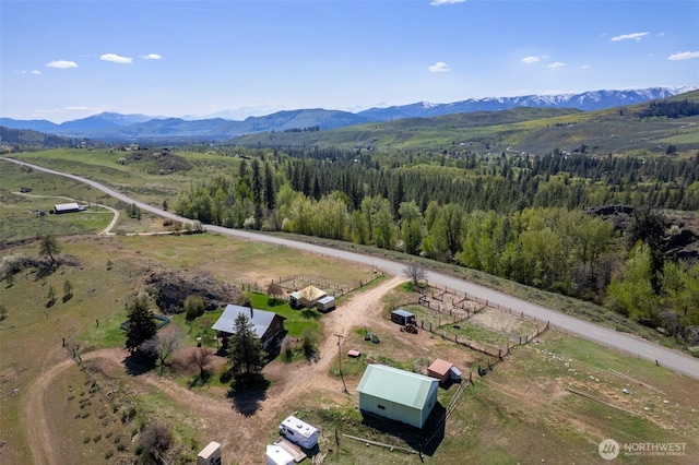 drone / aerial view featuring a rural view and a mountain view