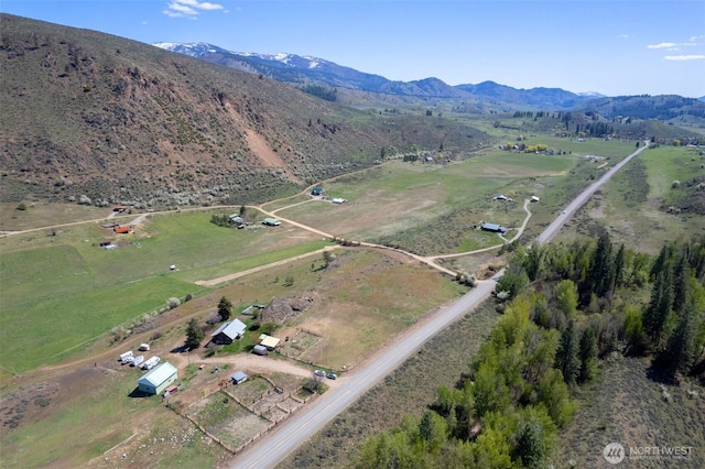 bird's eye view with a mountain view and a rural view