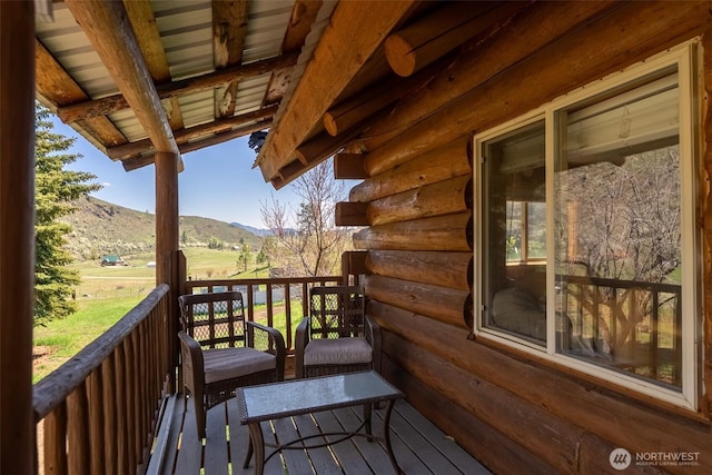 balcony with a deck with mountain view