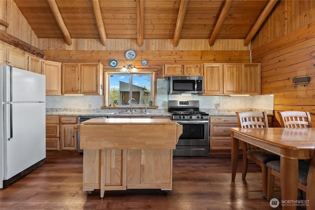 kitchen featuring a sink, appliances with stainless steel finishes, light brown cabinets, and wooden ceiling