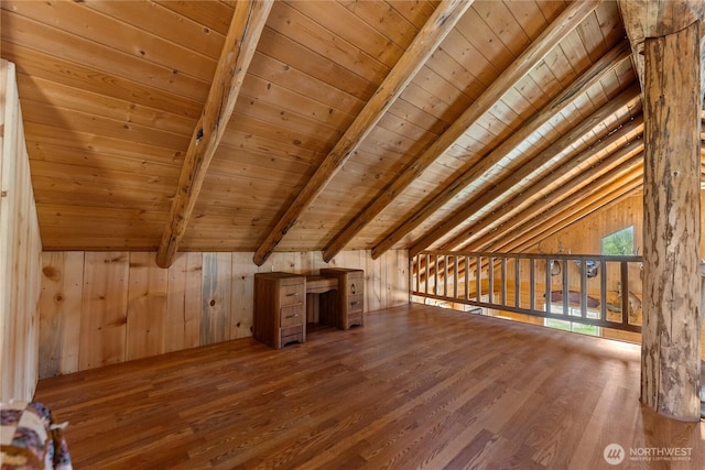 bonus room featuring wooden walls, vaulted ceiling with beams, wood ceiling, and wood finished floors