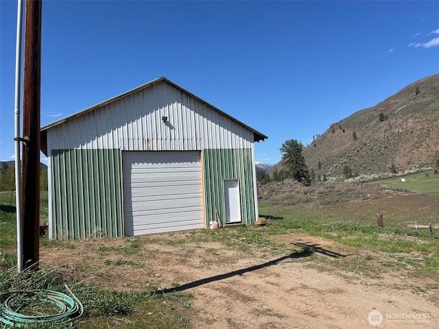 detached garage featuring a mountain view