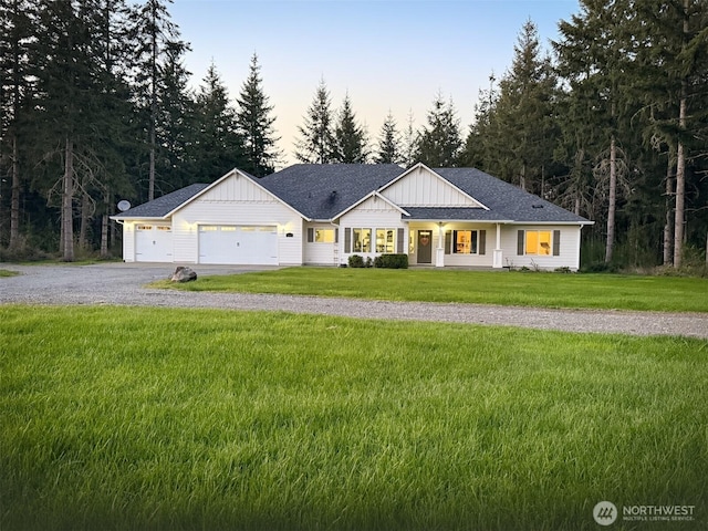 118 Woodview Ln, Napavine, WA 98596 - modern inspired farmhouse featuring a lawn, board and batten siding, an attached garage, and gravel driveway